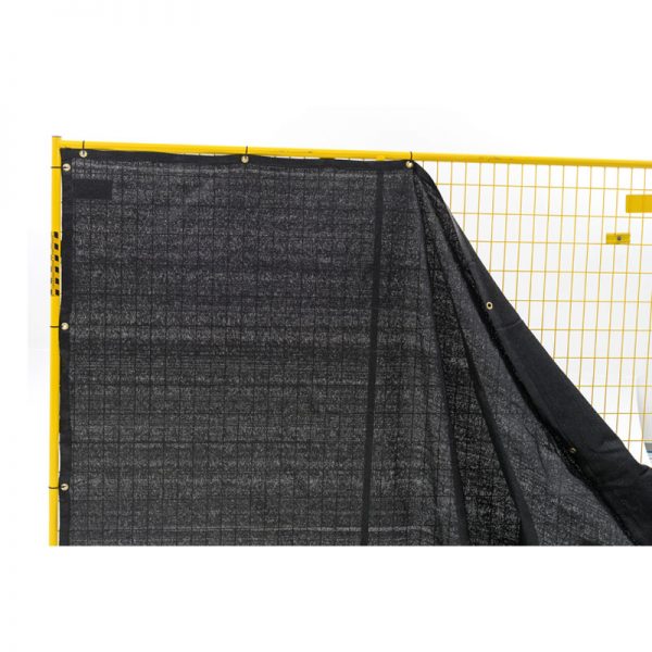 yellow fence with black windscreen