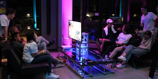 people playing video games at video game table