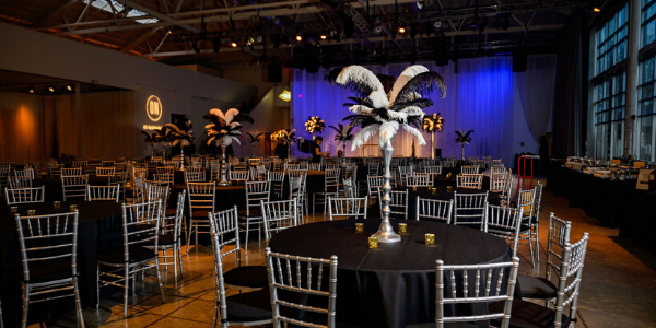 Black and white event space with blue lit backdrop