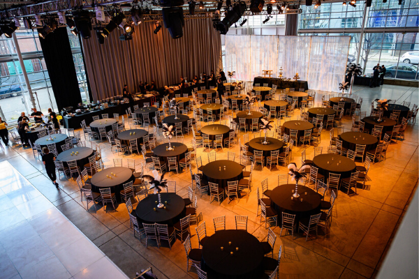 Table settings with black table cloths and metallic chairs