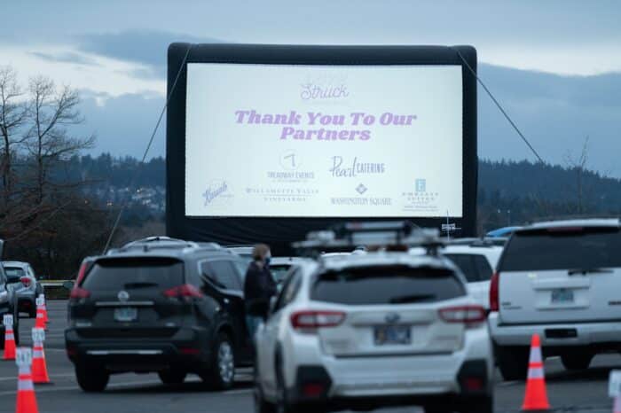Outdoor movie screen at Love Struck Drive-In event