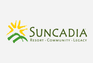 a logo with a sun and mountains